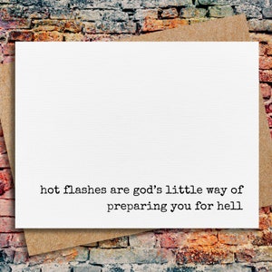 May include: A white card with black text that reads "hot flashes are god's little way of preparing you for hell"