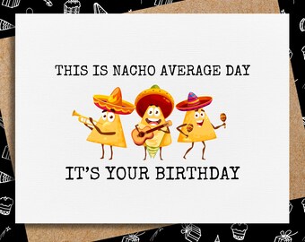 May include: A white card with the text "This is Nacho Average Day It's Your Birthday" and a cartoon image of three tortilla chips wearing sombreros and playing musical instruments.
