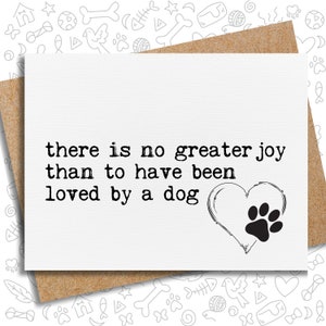 May include: A white card with black text that reads "there is no greater joy than to have been loved by a dog". A black paw print is inside a heart shape.