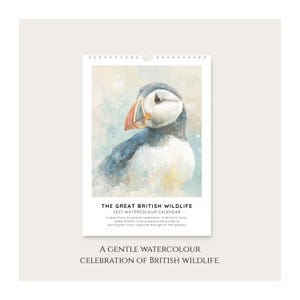 The image is a poster for a calendar featuring a close-up of a puffin bird.