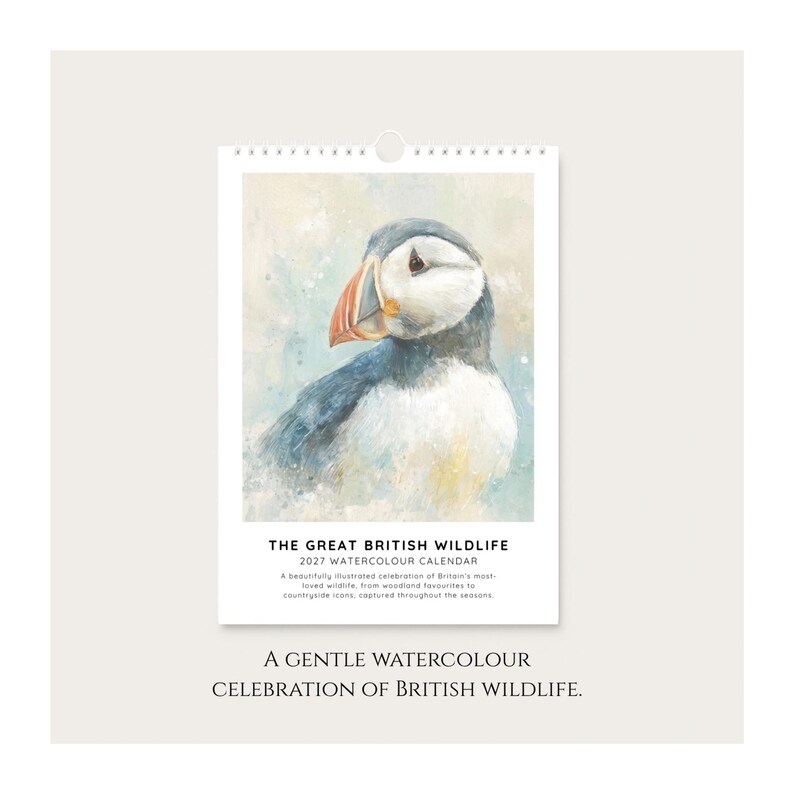 The image is a poster for a calendar featuring a close-up of a puffin bird.