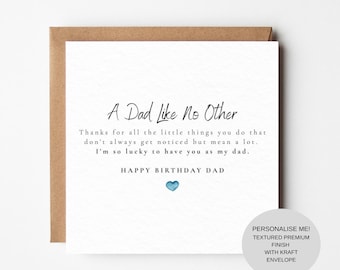 May include: A white square greeting card with black text that reads A Dad Like No Other, followed by a message of appreciation and Happy Birthday Dad, featuring a small blue watercolor heart at the bottom, paired with a brown kraft envelope.