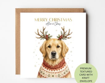 May include: A square greeting card featuring a golden retriever wearing a red and white patterned sweater and reindeer antlers with holly berries. The text reads MERRY CHRISTMAS Alice & Chris. The card is paired with a brown kraft envelope.