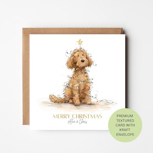 May include: A square greeting card featuring a watercolour illustration of a golden-brown dog tangled in colourful Christmas lights with a yellow star on its head. The text reads MERRY CHRISTMAS and Alice & Chris below the dog illustration.
