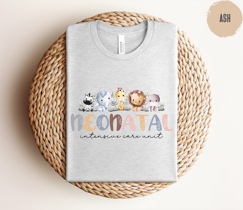 May include: A light gray t-shirt with a design of colorful animals and the text "NEONATAL intensive care unit".