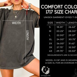 May include: Size chart for a unisex garment-dyed t-shirt. The chart shows the width and length measurements in inches for sizes S through 4X. The model is wearing a size XL for an oversized fit.