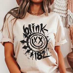 Blink 182 Smiley Face T-Shirt: Vintage Rock Style