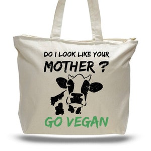 Zippered tote bag with printed message that says "Do I look like your Mohter?Go vegan"with the image of a cow