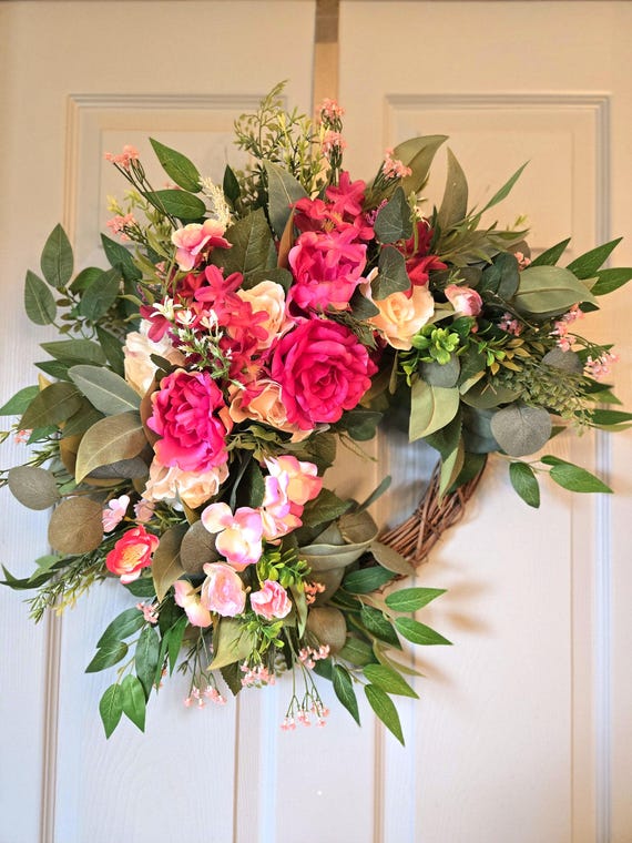 Summer or Spring grapevine with various types or eucalyptus and ficus, faux blush and fuscia roses.