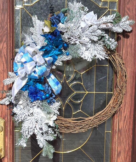 Christmas and all Winter  Blue,White and Silver Floral Grapevine Wreath. Will make your front door sparkle for the holiday season.