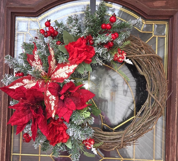 Candy Cane Poinsettia Wreath, classic and traditional poinsettias make up this grapevine perfect for the whole winter.