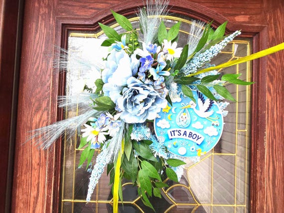 Baby Boy or Girl  Wreaths done in classic baby blue and pink fashion with matching faux florals and baby boy attachment.