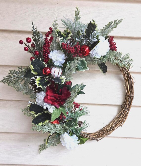 Red and White Christmas Wreath is a perfect little wreath for an apartment or office door, or given away as a holiday gift.