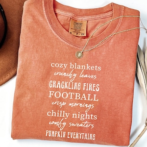 Cozy Blankets Crunchy Leaves Crackling Fires Football Shirt, Cute Fall List Tee, Womens Halloween Shirt, Thanksgiving Gifts, Comfort Colors®