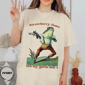 Comfort Colors® Strawberry Jams But My Glock Don't T-Shirt, Cute Frog Shirt, Parody Tee, Strawberry Jams Tee, Funny Glock Funny Frog T-Shirt image 1