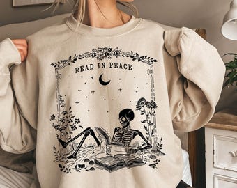 Read in Peace Sweatshirt, Skeleton Halloween Sweatshirt, Book Lover Skeleton Sweatshirt, Spooky Halloween Gift, Skeleton Reading Sweatshirt