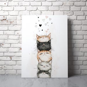 May include: A vertical art print featuring a stack of five cat faces, each with closed eyes and a serene expression. The cats are in shades of tan, black, orange, and gray. Small hearts float above the cats. The artwork is displayed against a white background.
