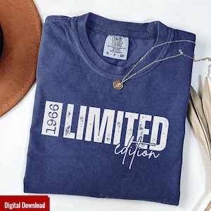 May include: A navy blue t-shirt with the text "1966 LIMITED edition" in white. A gold necklace with a pendant rests on the shirt. The shirt is a Comfort Colors brand, and the image is a digital download.