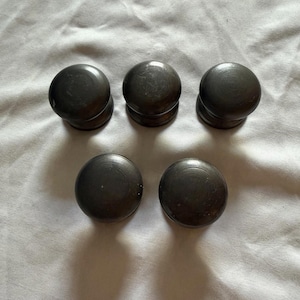 May include: A set of three ceramic mugs with a speckled, matte finish. The mugs are in shades of cream, light gray, and dark gray. Each mug has a simple, minimalist design, perfect for coffee or tea.