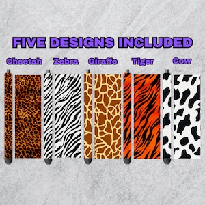 May include: Five different animal print designs for a pen or pencil. The designs are cheetah, zebra, giraffe, tiger, and cow. The designs are all in black and white, brown and white, or orange and black.