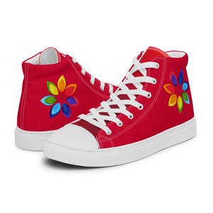 May include: Red high-top canvas trainers with white laces and a rainbow flower design on the side.