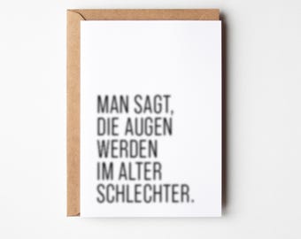 May include: A white card with black text that reads "Man sagt, die Augen werden im Alter schlechter."