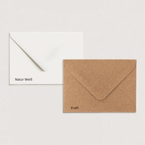 May include: Two envelopes, one white with the text "Natur Wei&szlig;" and one brown with the text "Kraft".