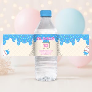 May include: A clear water bottle with a blue cap and a custom label. The label features a blue ice cream cone design with sprinkles, the name "Olivia's", the number "10", and the text "BIRTHDAY PARTY!" with baseball graphics.