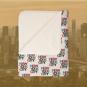 AuthentiCITY New York City Sherpa Blanket, 2 sizes, Velvet Feel, Colorful City Names on Oatmeal Fleece, Soft Sherpa Back
