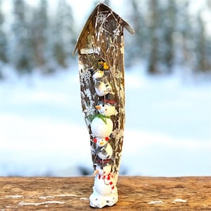 May include: A rustic wooden sign with the text "Welcome to our home" in white lettering. The sign features a distressed finish and a simple, inviting design, perfect for a front porch or entryway.