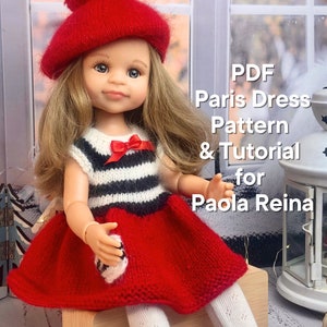 Könnte beinhalten: Eine Puppe mit roter Baskenmütze und einem rot-weiß gestreiften Kleid. Das Kleid hat einen roten Rock und eine kleine rote Schleife. Der Text auf dem Bild lautet "PDF Paris Dress Pattern & Tutorial for Paola Reina."