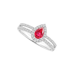 May include: A silver-toned ring featuring a central pear-shaped red gemstone surrounded by a halo of small white stones. The band is split into two parallel rows, each encrusted with tiny white stones that extend from the central setting.