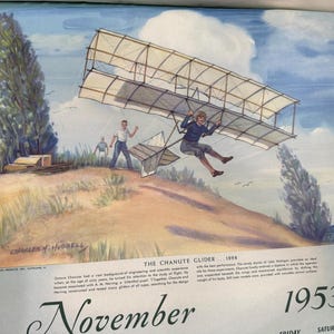 May include: Vintage illustration of the Chanute Glider from 1896, depicting a man piloting the glider in flight. The artwork features a blue sky, grassy hill, and two other figures on the ground. The text "November 1953" is visible at the bottom.