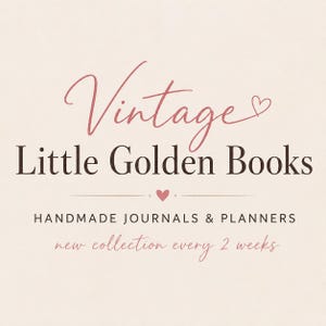 May include: A light beige graphic sign featuring the dark brown text Vintage Little Golden Books with a small pink heart. Below, the text reads HANDMADE JOURNALS & PLANNERS with a small heart and new collection every 2 weeks in pink script.