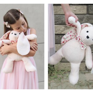 A young girl in a pink dress lovingly hugs a handmade plush bunny. This cute animal pattern is perfect for creating a DIY memorial gift. This easy sewing pattern is ideal for beginners looking for plushie patterns pdf to create a keepsake. Whether you are using this as a memory bear pattern, a bunny sewing pattern, this versatile design makes for a beautiful stuffed bear pattern or a special addition to any collection of toy sewing patterns and memory bear template projects.