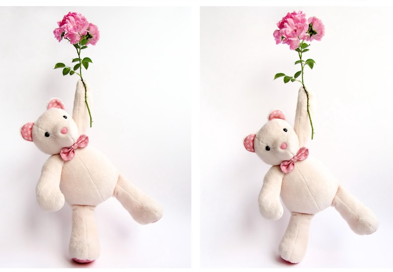 Two views of a cute handmade plush bear holding a stem of pink roses. This memory bear pattern and teddy bear pattern is perfect for those looking for a bear sewing pattern or a bunny sewing pattern. This plush sewing pattern is available as plushie patterns pdf and serves as an excellent memory bear template. Create a cute animal pattern project with this easy sewing pattern, which is ideal for a DIY memorial gift.