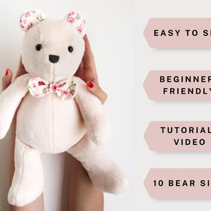May include: A pink plush teddy bear with a floral bow tie. The bear is being held by a person's hands. The image includes text that says "Easy to Sew", "Beginner-Friendly", "Tutorial + Video", and "10 Bear Sizes".