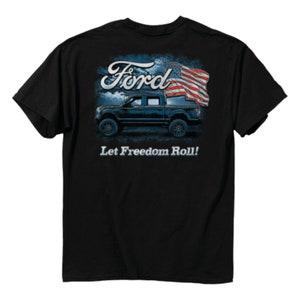 May include: Black t-shirt with a blue Ford pickup truck and an American flag. The text "Ford" is in a white font and the text "Let Freedom Roll!" is below the truck.