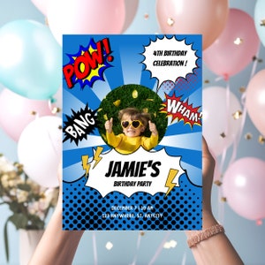 May include: A blue and red comic book style birthday party invitation with a photo of a child wearing sunglasses and a yellow shirt. The invitation says "Jamie's Birthday Party" and includes the date and time of the party. The invitation also features comic book style words like "Pow!" and "Wham!"