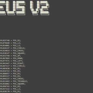 May include: A dark gray computer screen displaying lines of programming code. The text ZEUS V2 appears at the top in a blocky, pixelated font. Below, multiple lines of code starting with define ZeusMLB followed by PS5 controller button inputs.