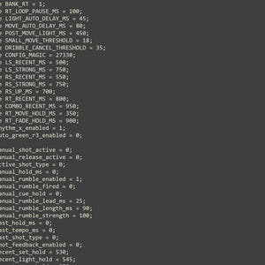 May include: A dark gray computer screen displaying lines of C programming code starting with define statements such as BANK_RT equals 1, followed by various integer variables including manual_shot_active set to 0 and manual_rumble_enabled set to 1.