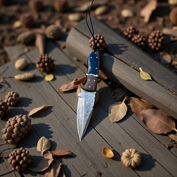 Damascus Steel, Hand Forged. 8 1/2” long. Beautiful Handle with Real Copper Flare. Genuine Tough Leather Sheath. Very Popular!