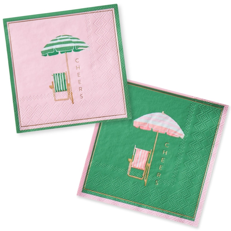 Two paper napkins with a pink and green background. Each napkin features a beach chair and cabana striped umbrella with the word 'CHEERS' printed on it. Perfect for a palm beach, or tropical birthday party, bridal shower, bachelorette, or dinner party.