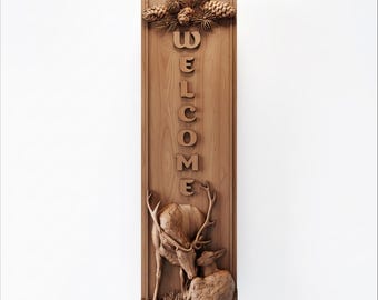 May include: Wooden welcome sign with carved deer and pinecones. The sign features the word "WELCOME" in raised letters. The deer are intricately detailed, and the pinecones are at the top of the sign. The sign is rectangular and made of light brown wood.