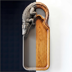 May include: A decorative wall-mounted tray with a detailed alligator sculpture. The alligator is gray, and the tray is half gray and half wood-toned. The alligator's tail forms a handle. The website address "www.3dwave.us" is printed at the bottom.