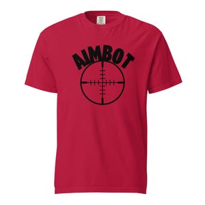 May include: Red t-shirt with a black graphic of a crosshair and the word "AIMBOT" above it.