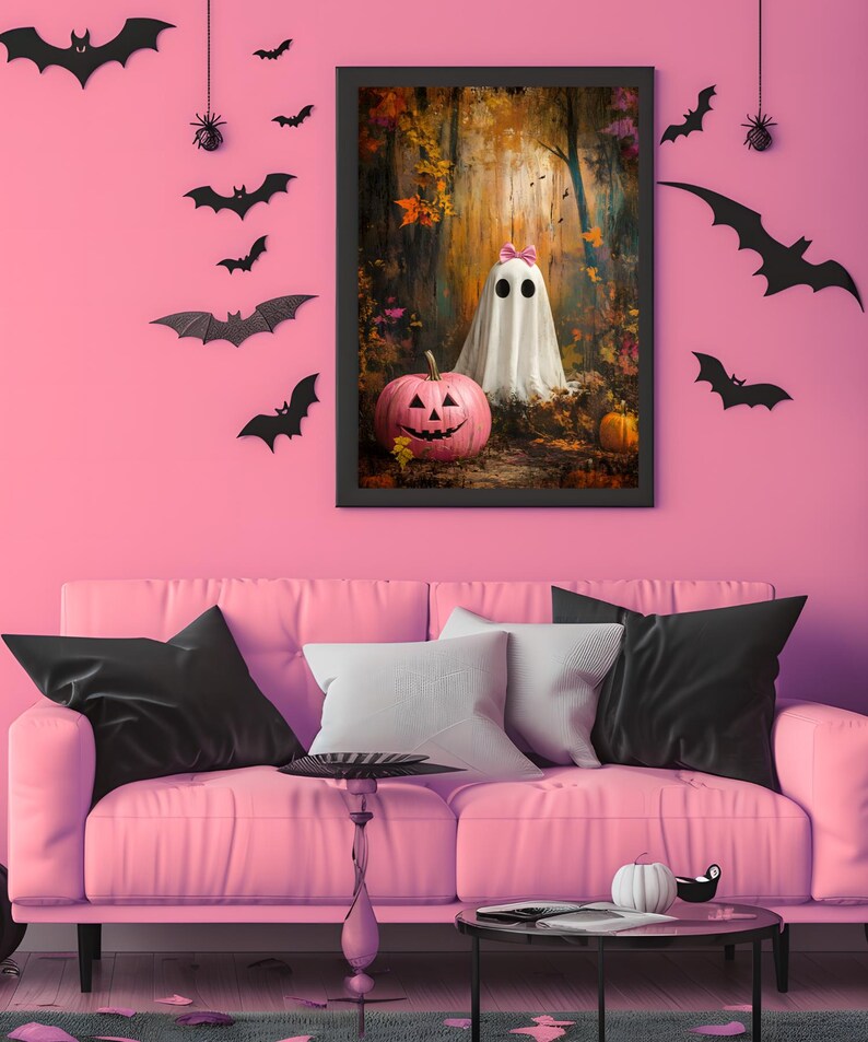 May include: A framed print of a ghost wearing a pink bow in a woodland setting. The ghost is standing next to a pink jack-o'-lantern. The print is hanging on a pink wall with black bats and a spider's web.