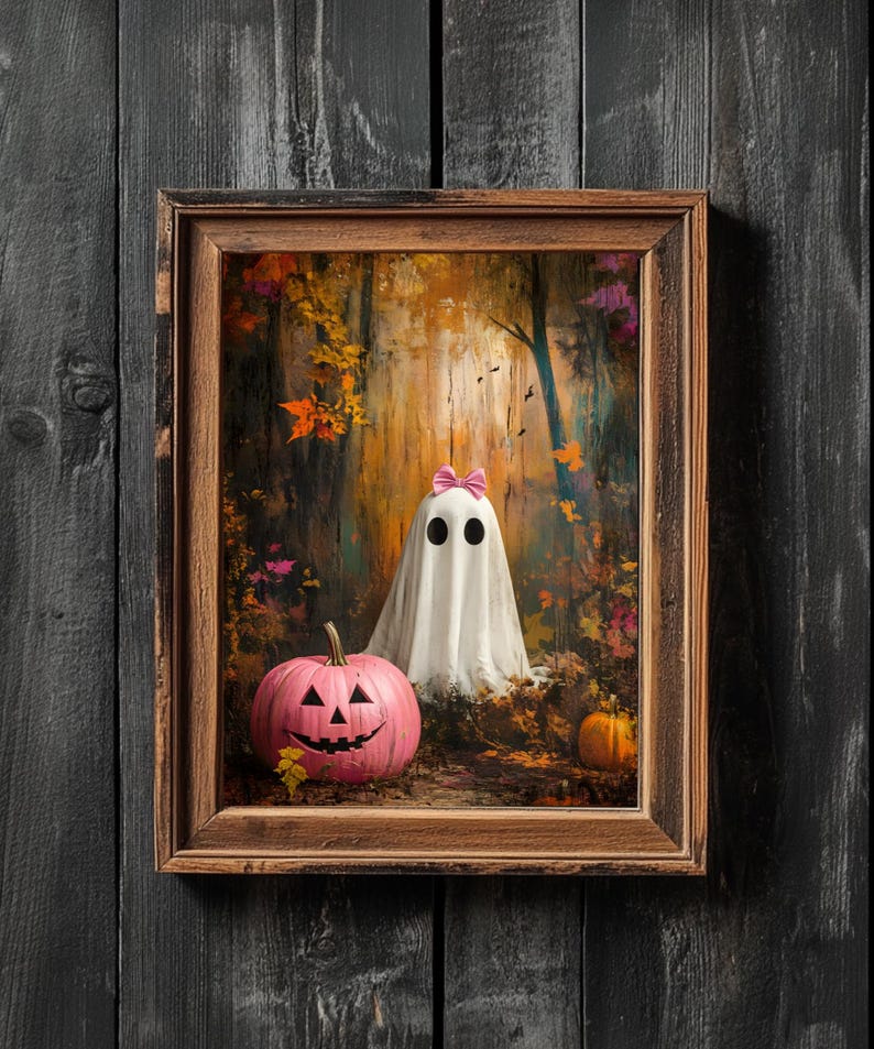 May include: A framed painting depicting a white ghost wearing a pink bow in a woodland scene. A pink jack-o'-lantern is in the foreground.