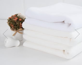 Maille jersey 100 % coton double épaisseur, tissu pointelle