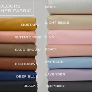 May include: A swatch card displaying 23 different colours of leather fabric. The colours are arranged in two columns, with the names of the colours listed below each swatch. The colours include ivory, light beige, mustard, vintage pink, pink, sand brown, peach, sky blue, red brown, deep blue, lavender, black, and deep grey.